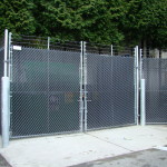 Chain-link with Privacy Slats and Bollard Chain-link with Privacy Slats and Bollard